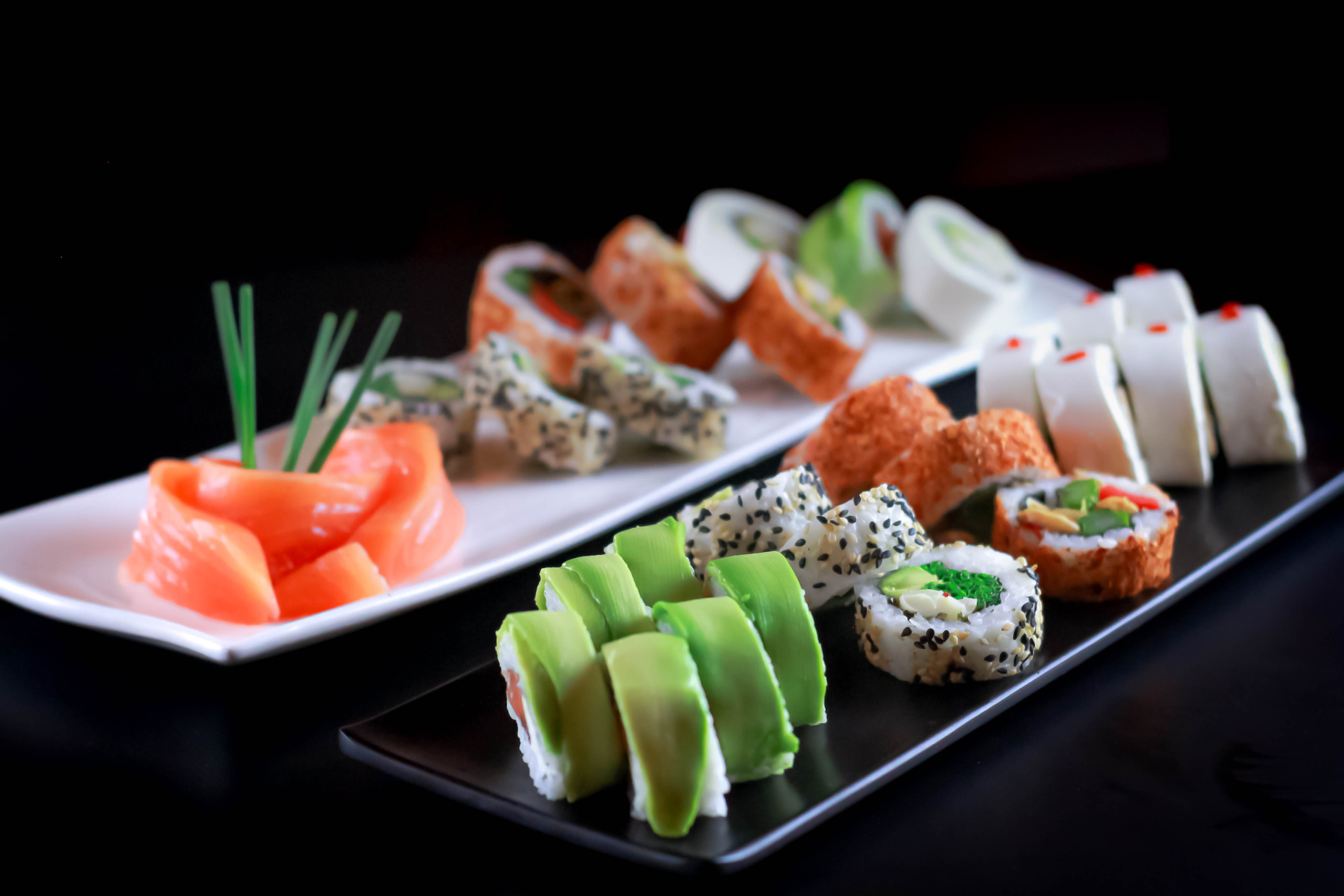 Sushi and Sashimi on Ceramic Plates